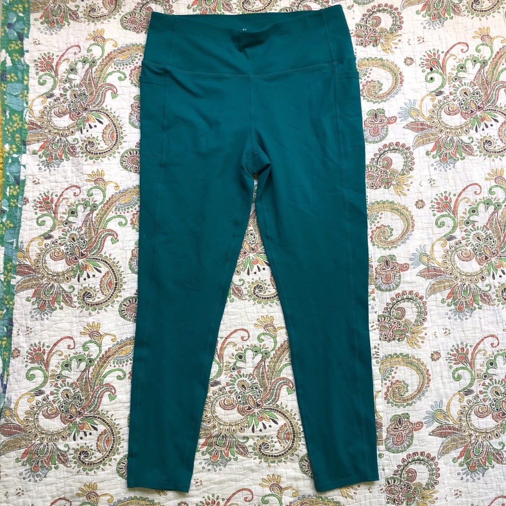 Teal green high-waisted leggings with side pockets